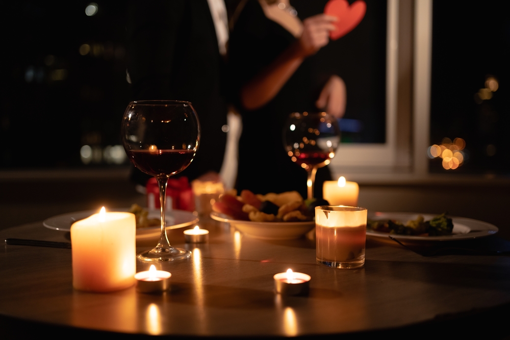 Romantic,Dinner,Setting,,Red,Wine,In,Glasses,And,Candles,,Date